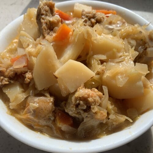 Polish sauerkraut soup served with Impossible Spicy Sausage.